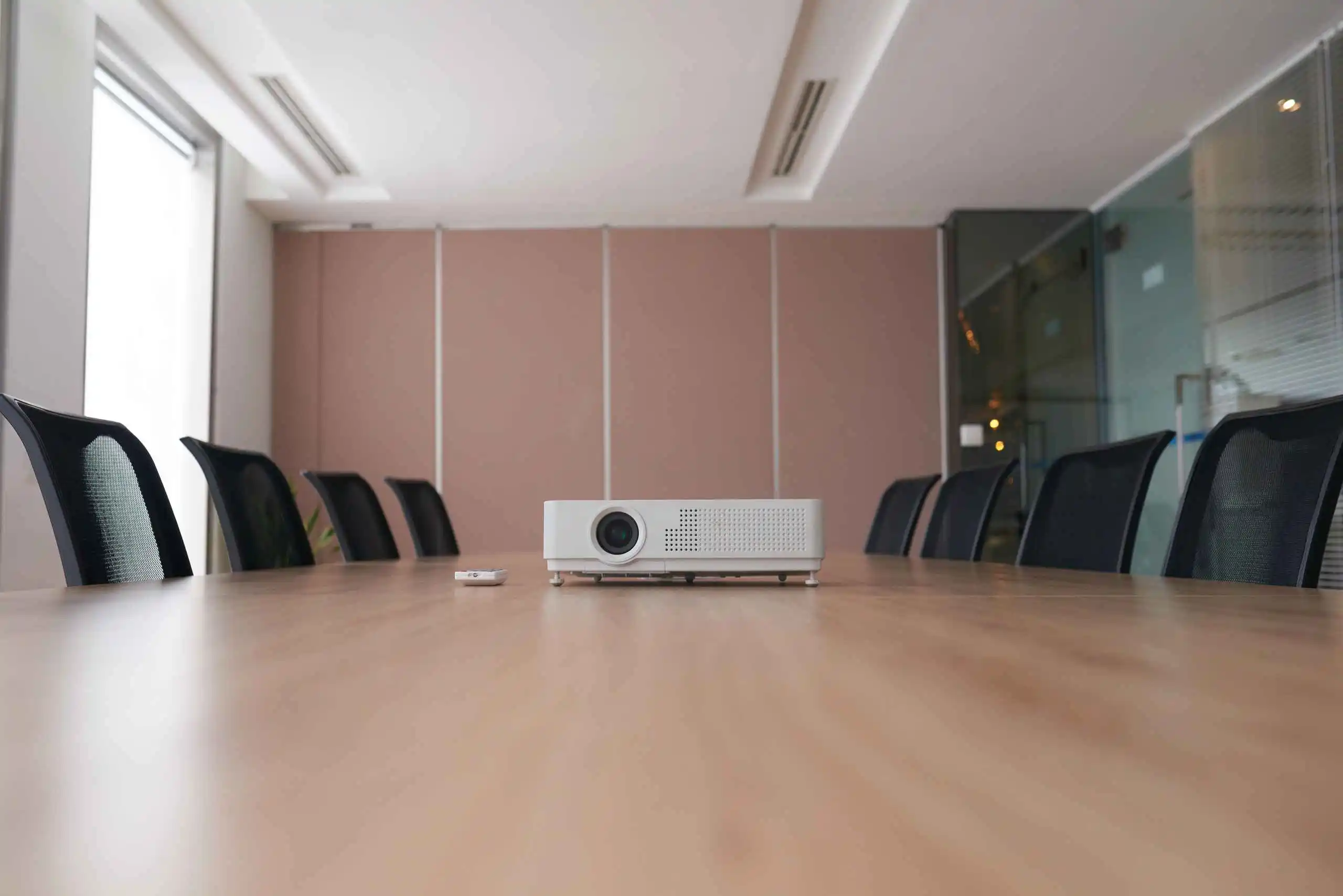 Pan Shot Empty Office With Projector Middle Conference Desk (1)